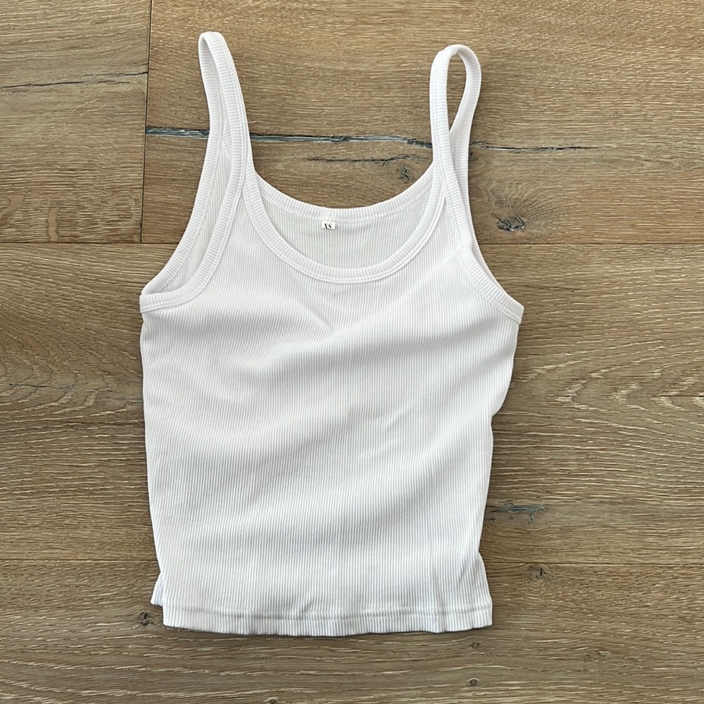 plain white tank top, totally model off duty vibe